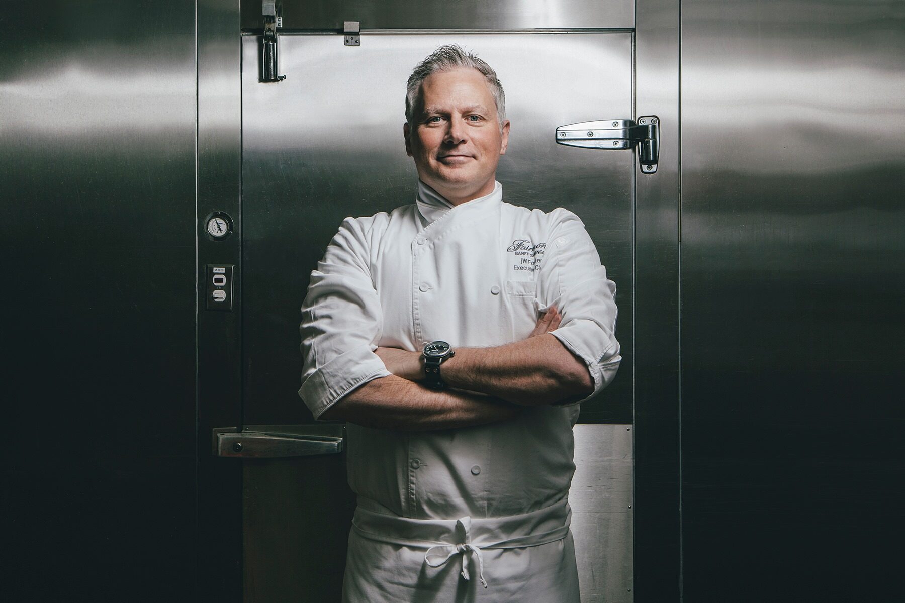 Chef portrait, stainless fridge