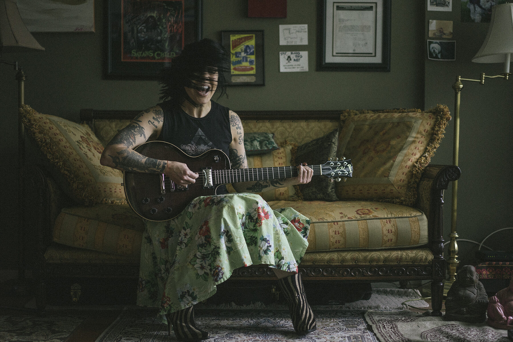 Guitarist on vintage couch
