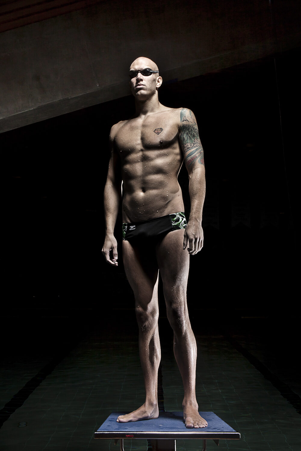Swimmer standing on diving block